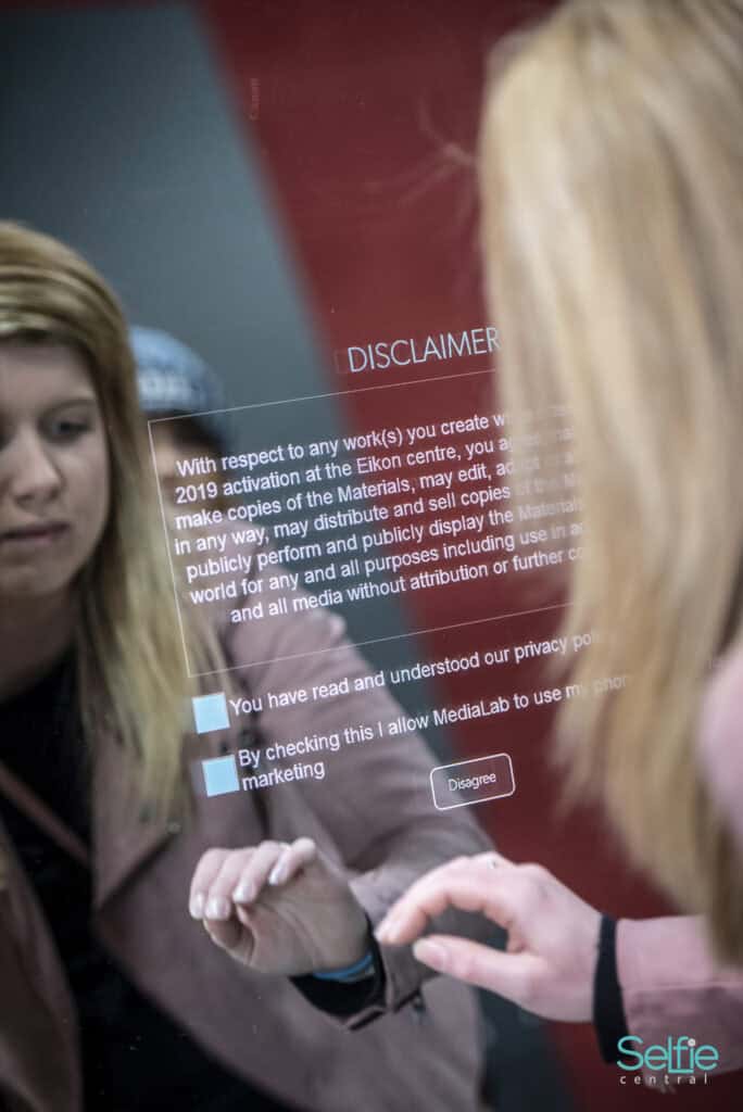 People using a digital photo booth at Selfie Central in Auckland.
