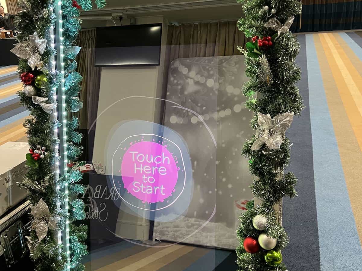 Selfie Mirror booth with Christmas lighting at a corporate Christmas party