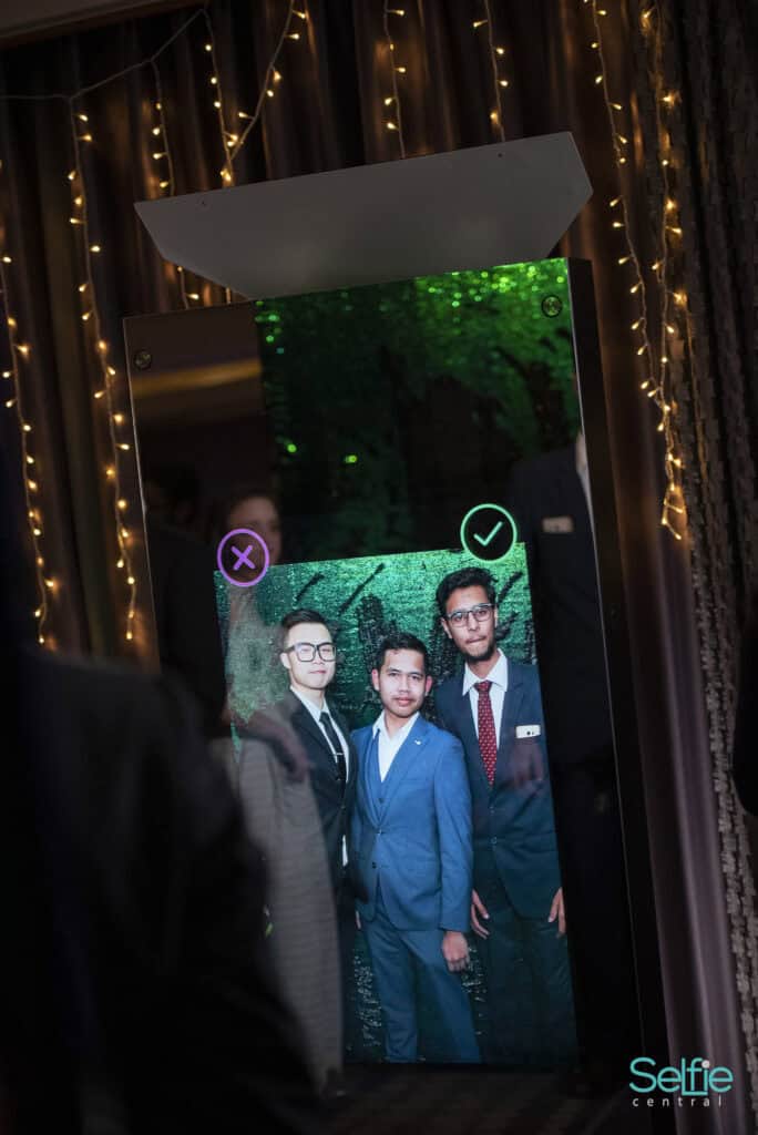 Selfie Central photo booth with group of people at an event in Auckland.
