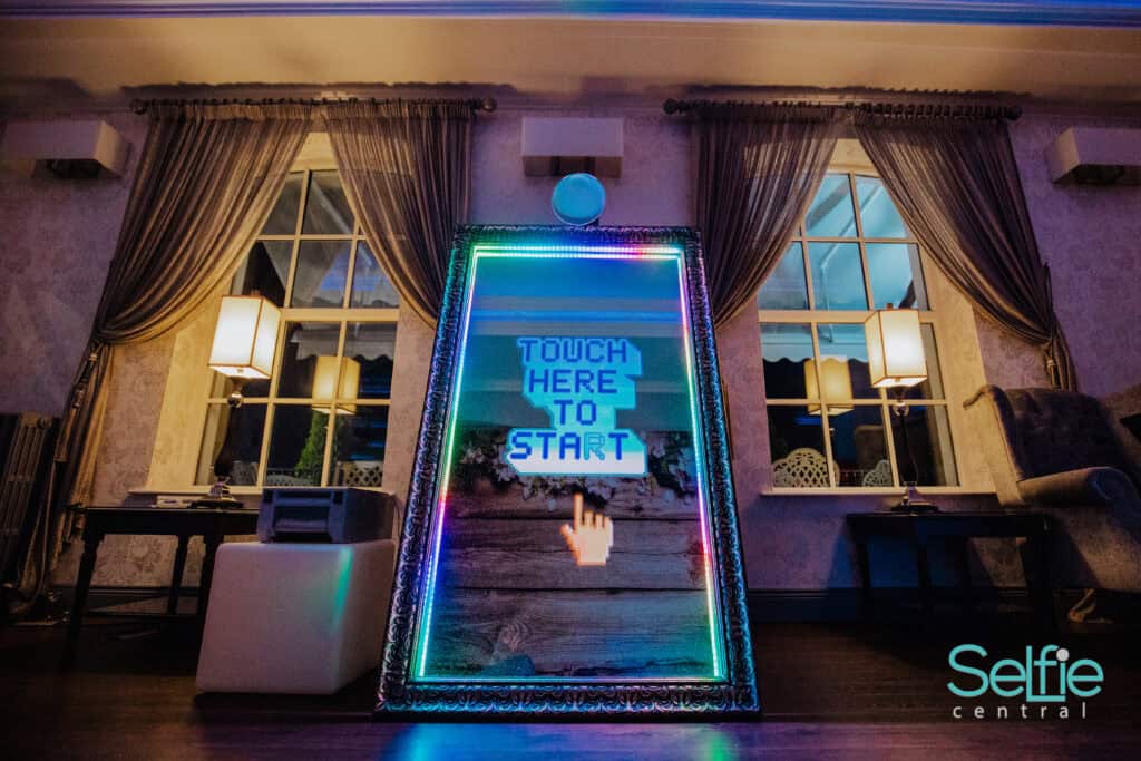 Interactive photo booth with LED screen in Auckland event space.