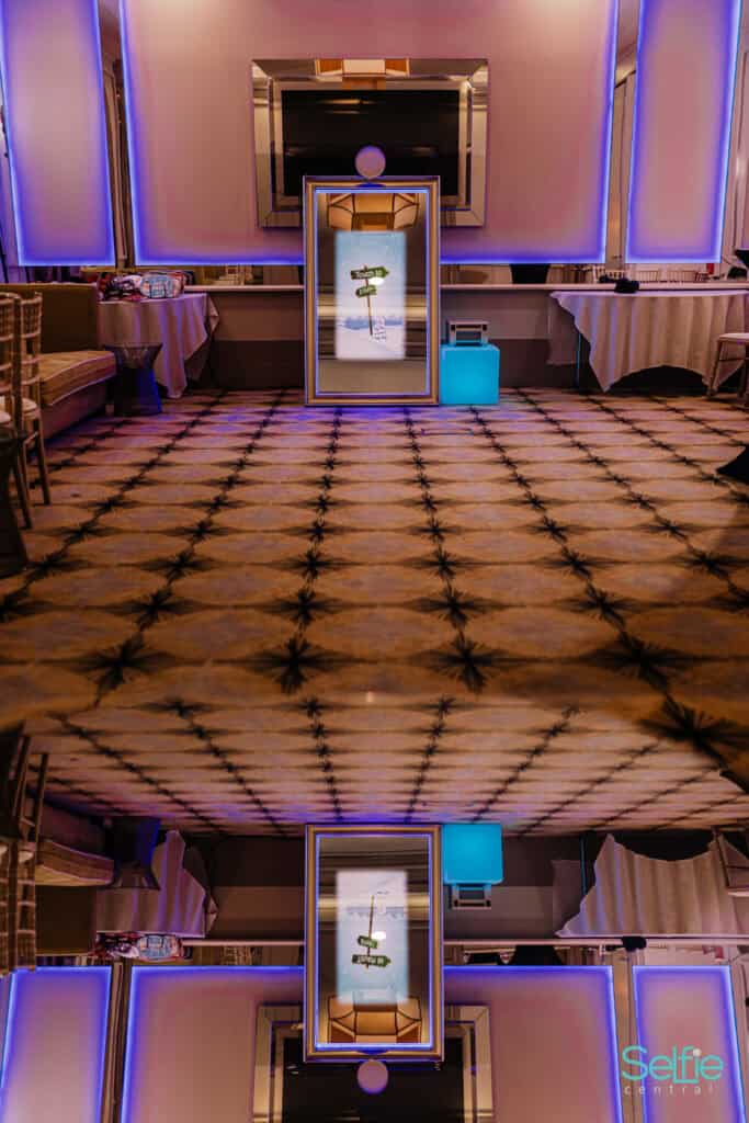 Modern photo booth with colorful lighting at an event in Auckland.